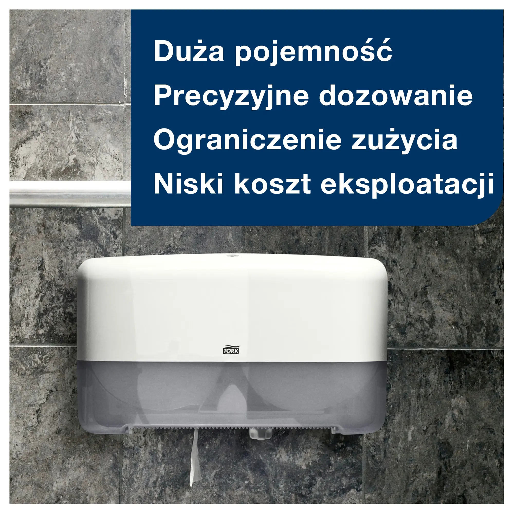 Papier toaletowy Tork Mini Jumbo T2, biały dozownik ścienny na tle szarych kafelków