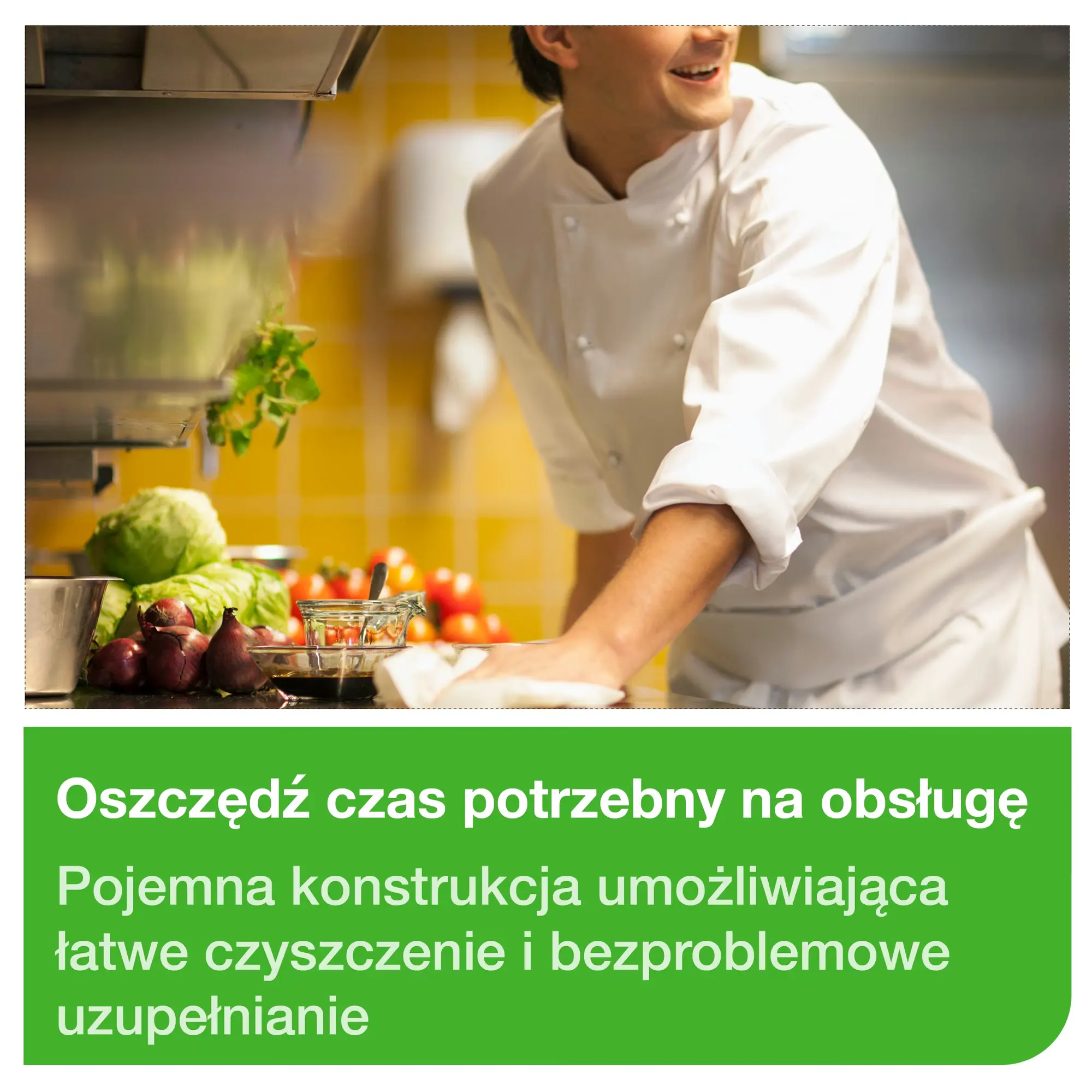 Dozownik Tork system M2, kucharz wycierający blat w profesjonalnej kuchni